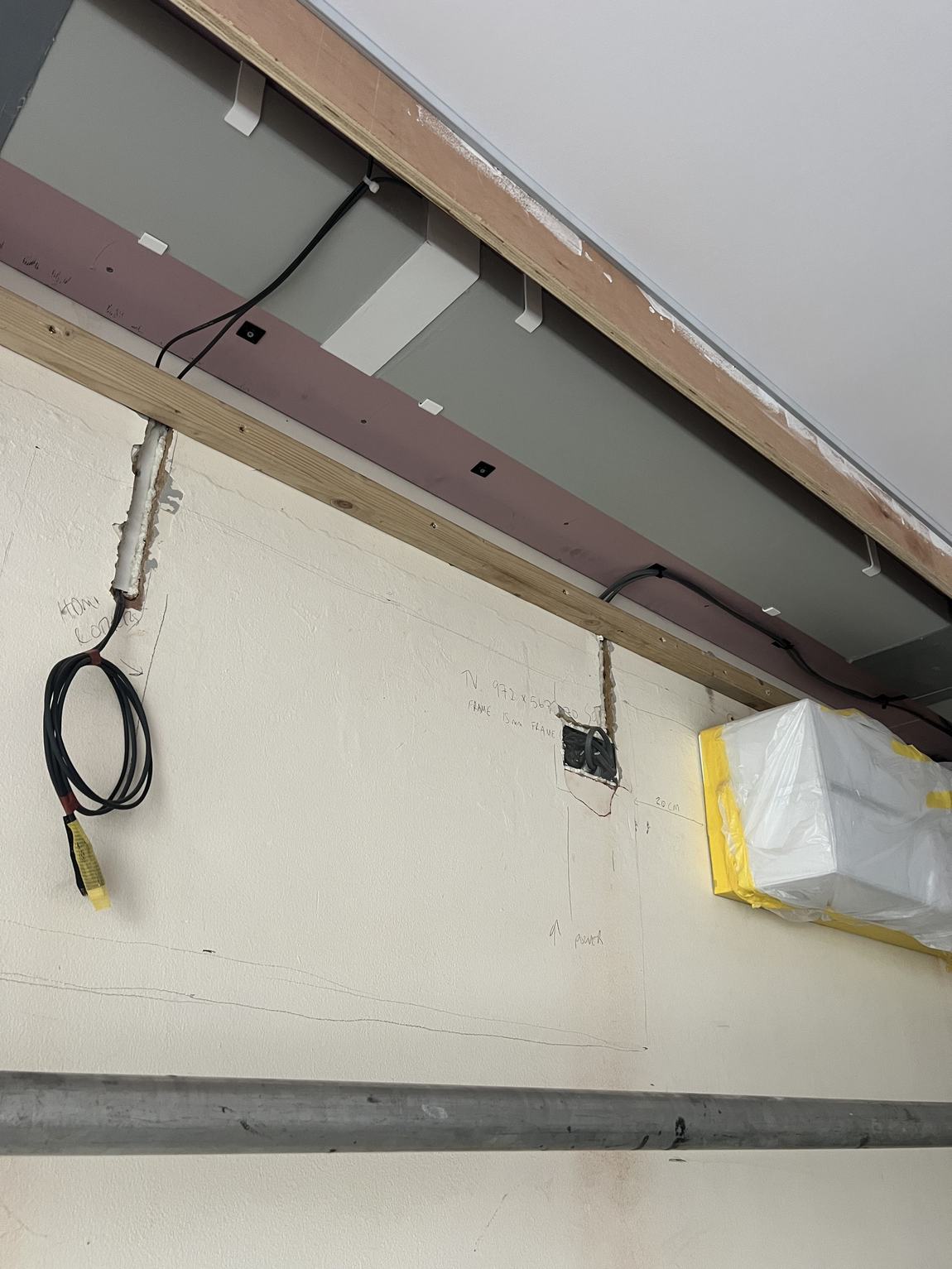 Pencil markings on the wall for television wiring