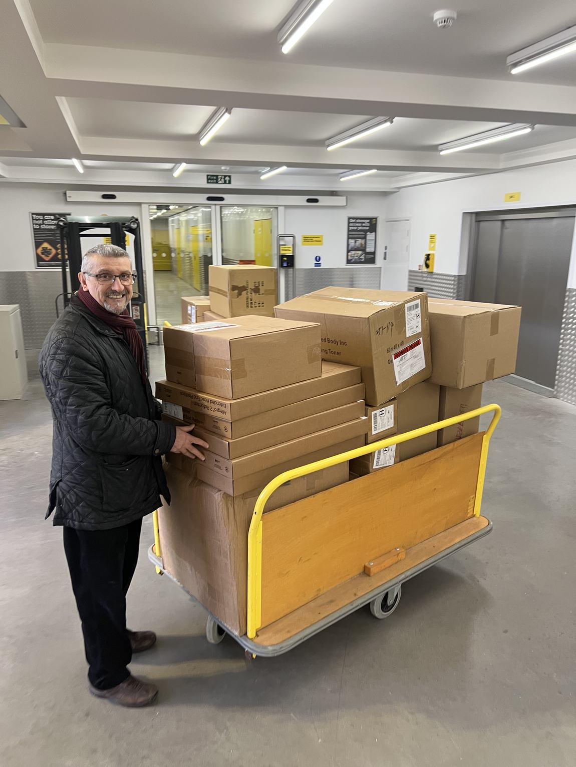 Behrouz with a trolley loaded with reformer boxes