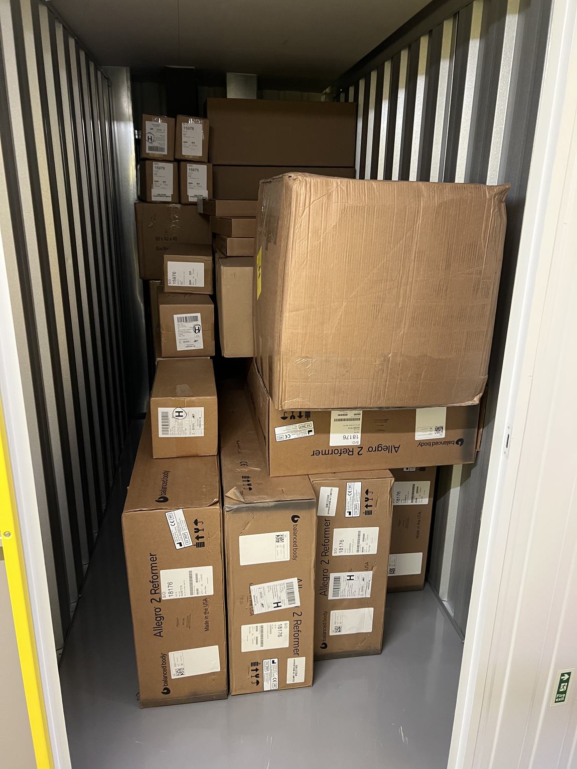 The storage unit packed floor to ceiling with boxes