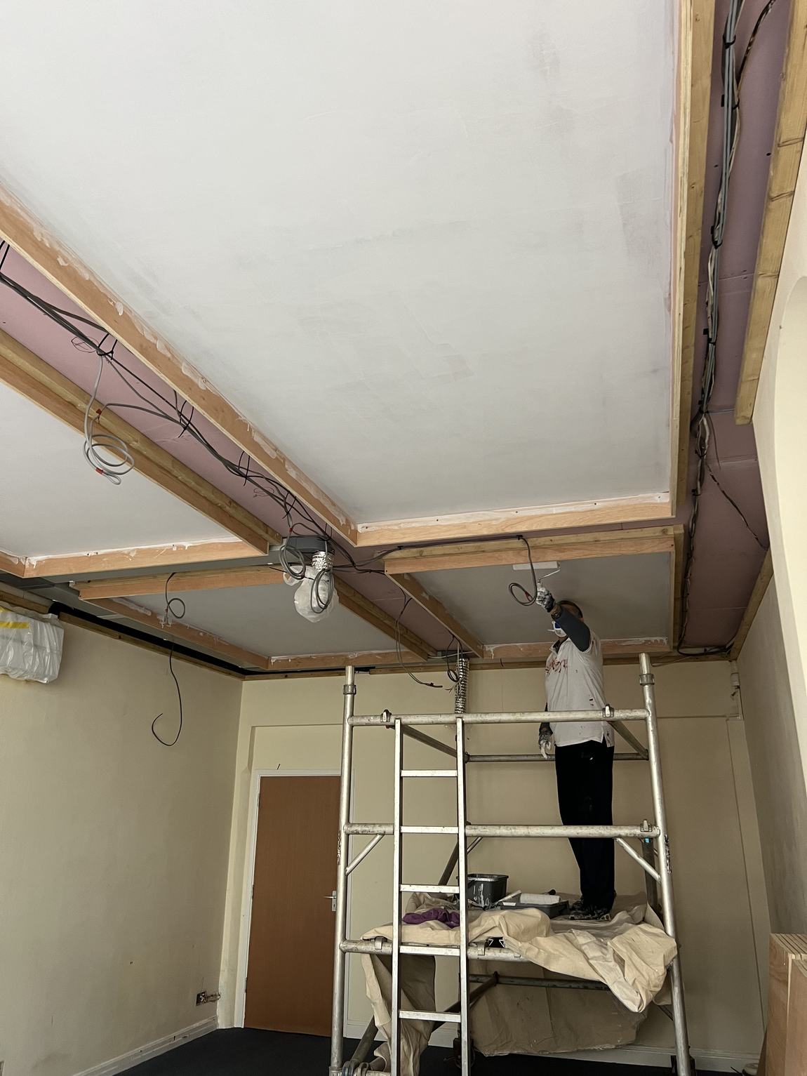 The coffered ceiling receiving its first white coat