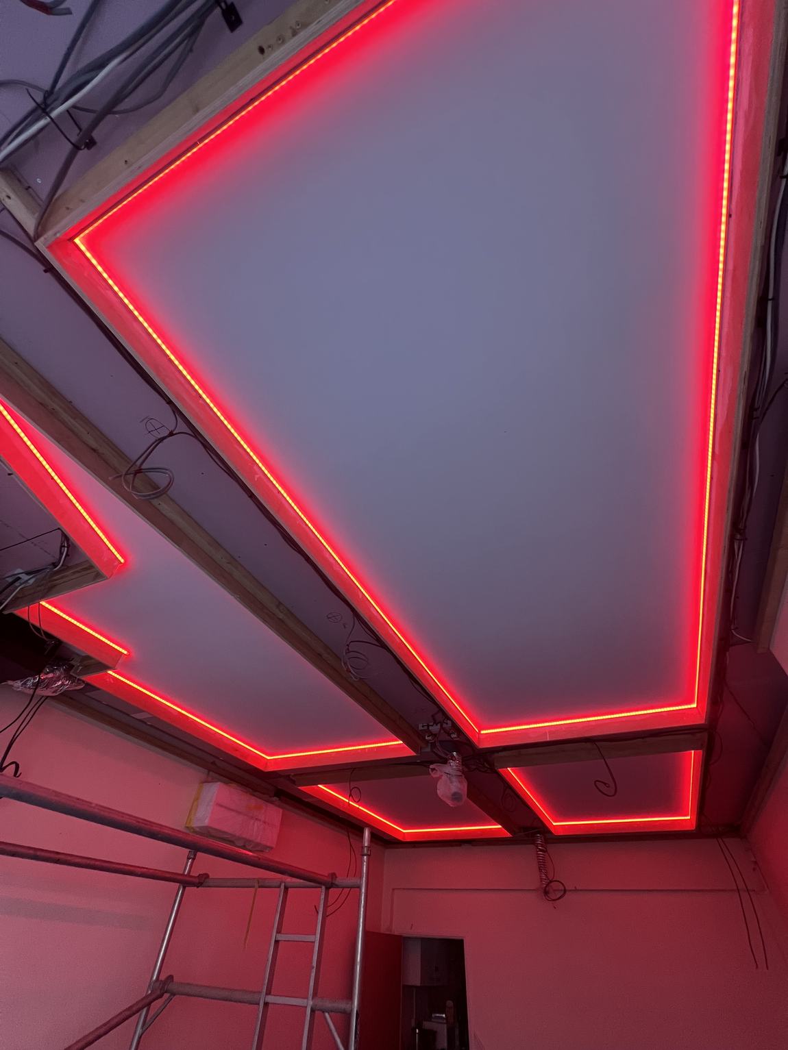The coffered ceiling lit red