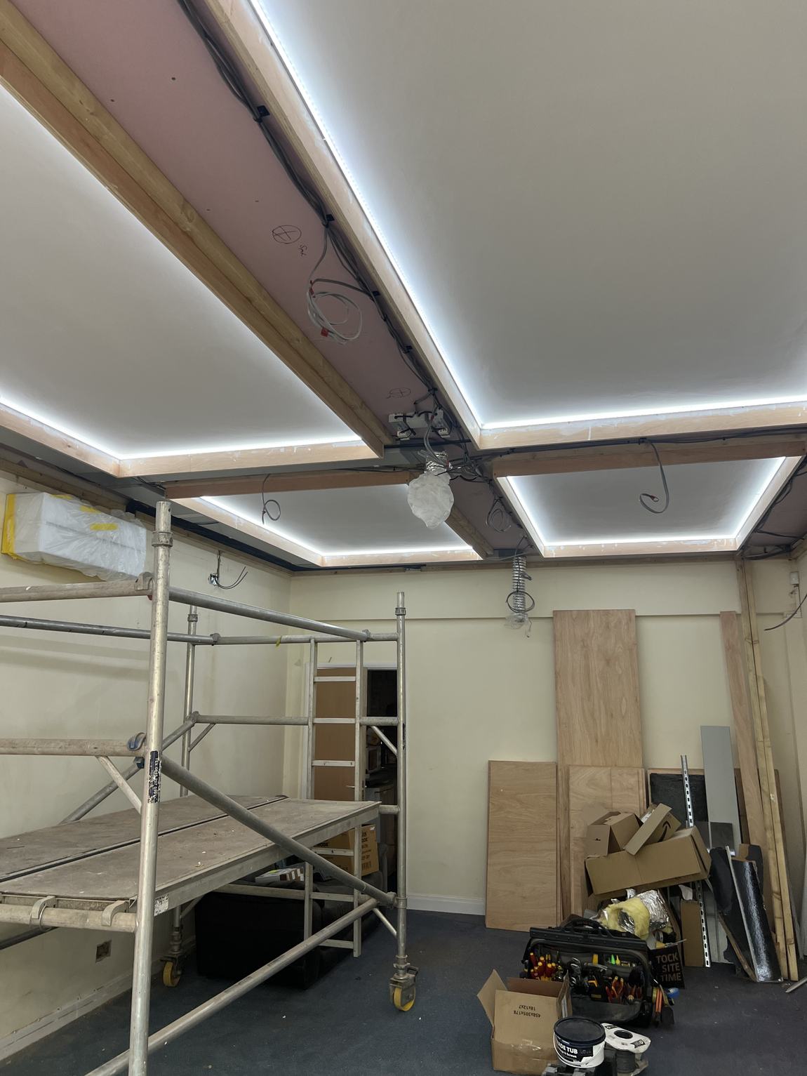 The coffered ceiling lit white