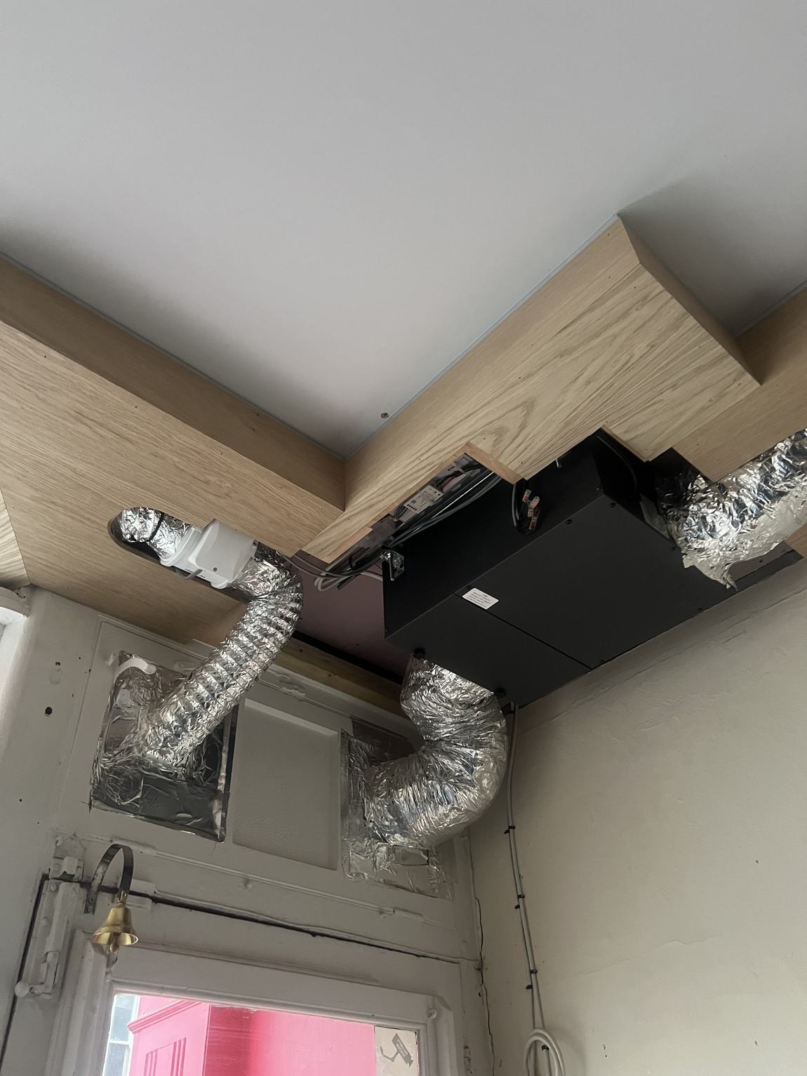 The ventilation unit tucked into the oak ceiling