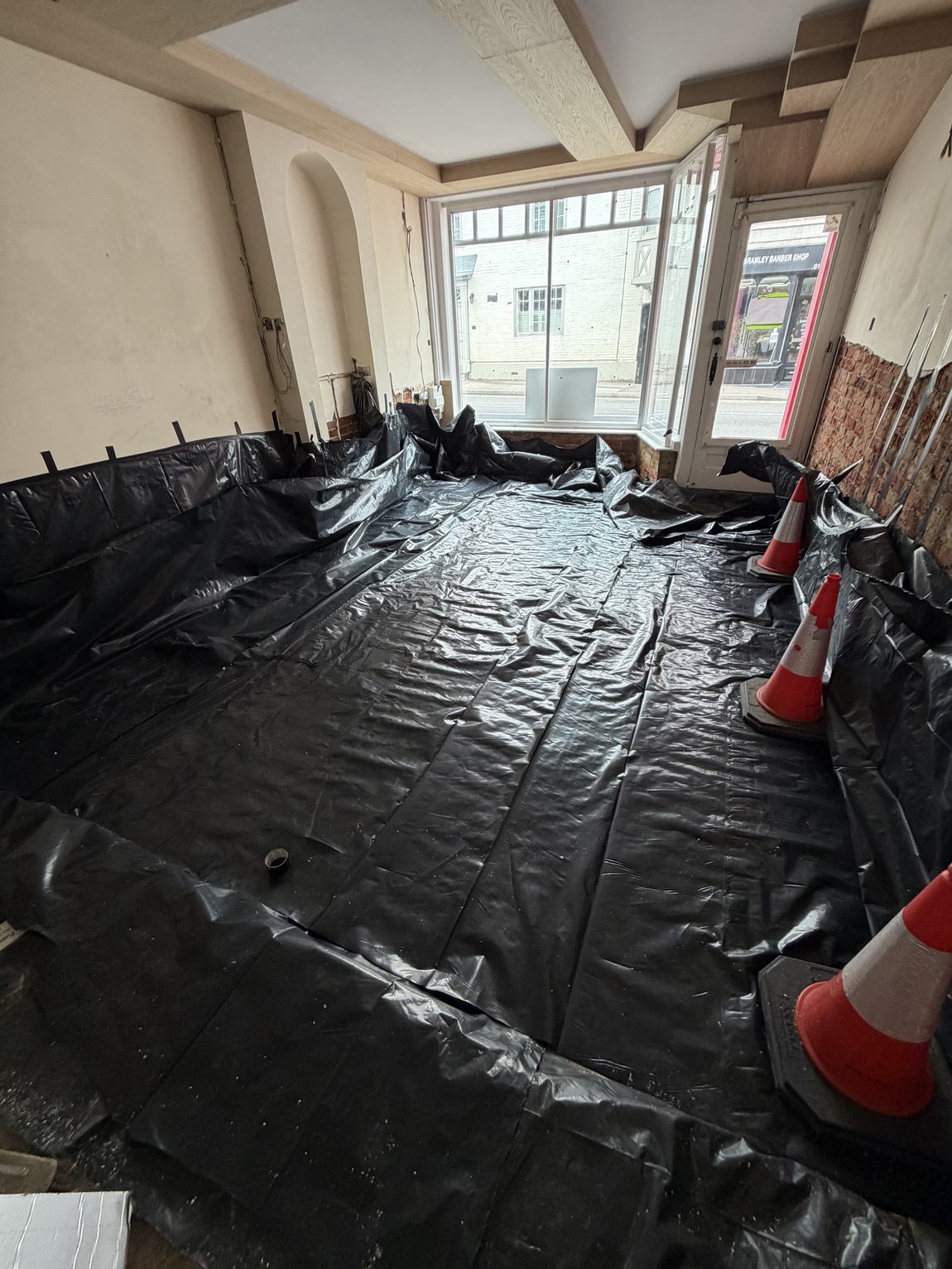 Damp-proof membrane laid across the floor and up the walls