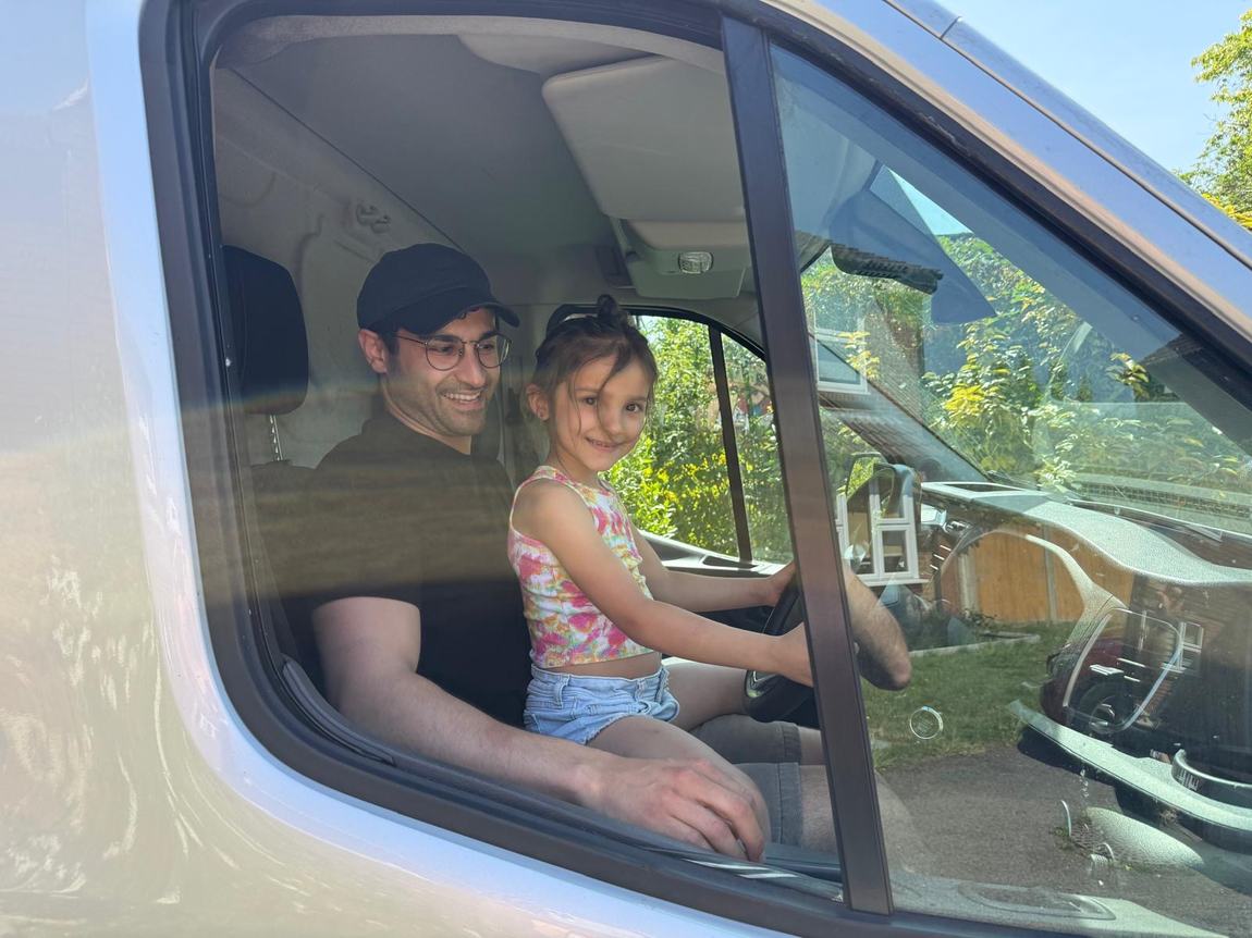 Ramin and his niece in the cab of the van