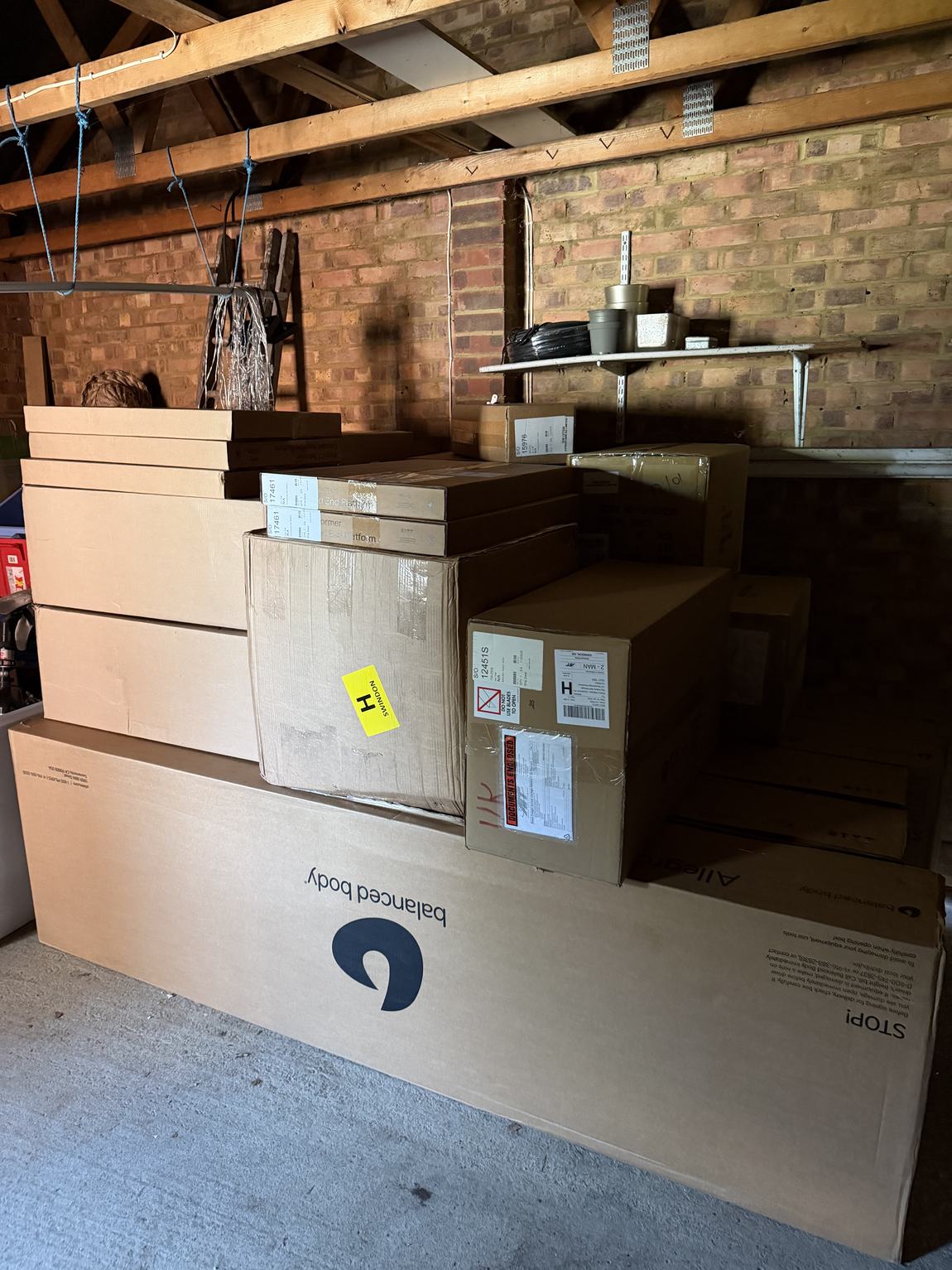 Reformer boxes stacked in a garage
