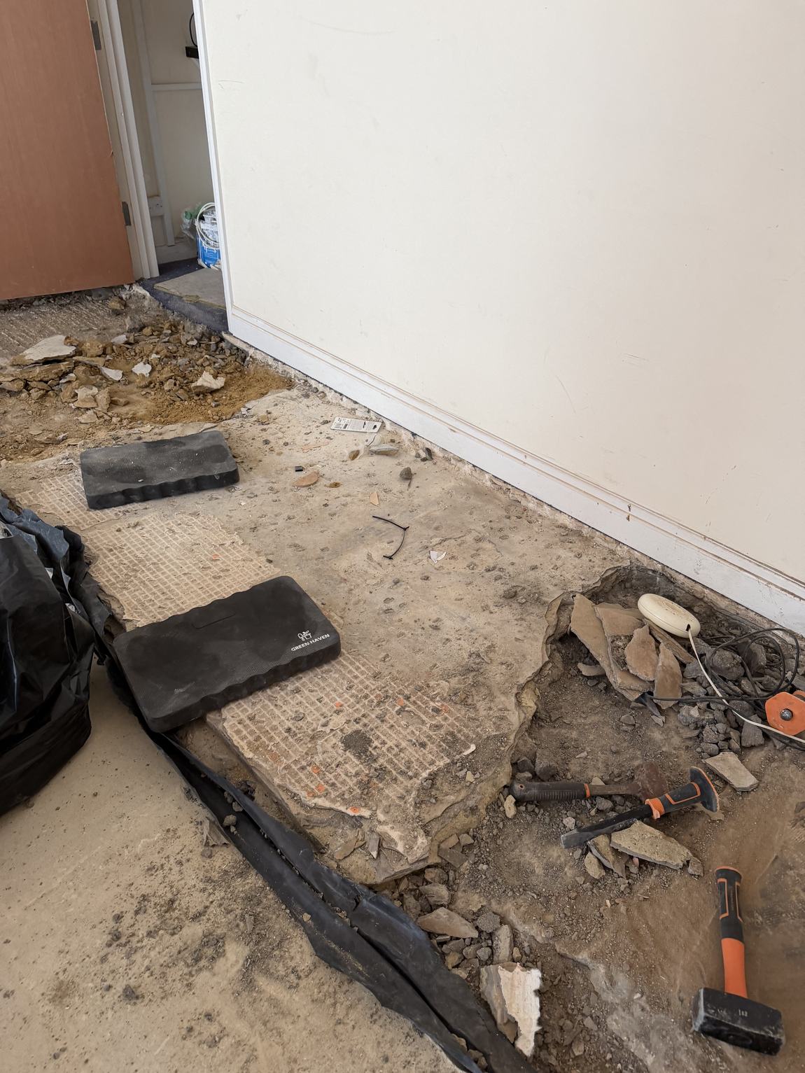 The screed hacked up revealing different concrete layers